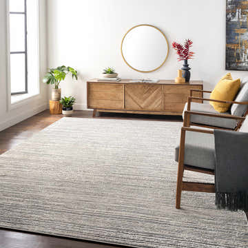 Living room scene with a Yemassee Tibetan striped area rug, wooden console, chairs, and plants. Contemporary style. Roomscene-Rectangle