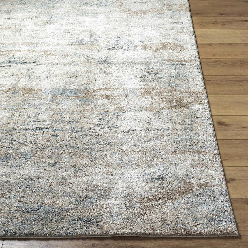 Close-up of the beige, gray, and tan Yoshe Thick Luxe Rug showing its contemporary design and soft, textured pile. Front
