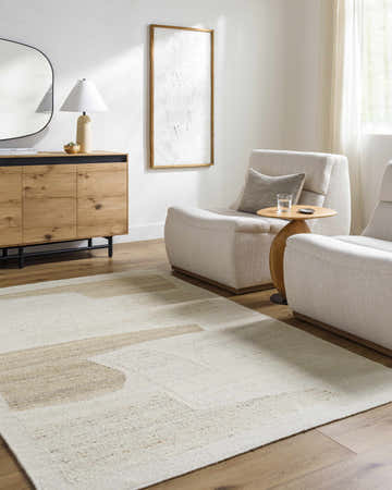 Living room scene with neutral furniture and the Airell Area Rug in brick red and pearl. Roomscene-Rectangle
