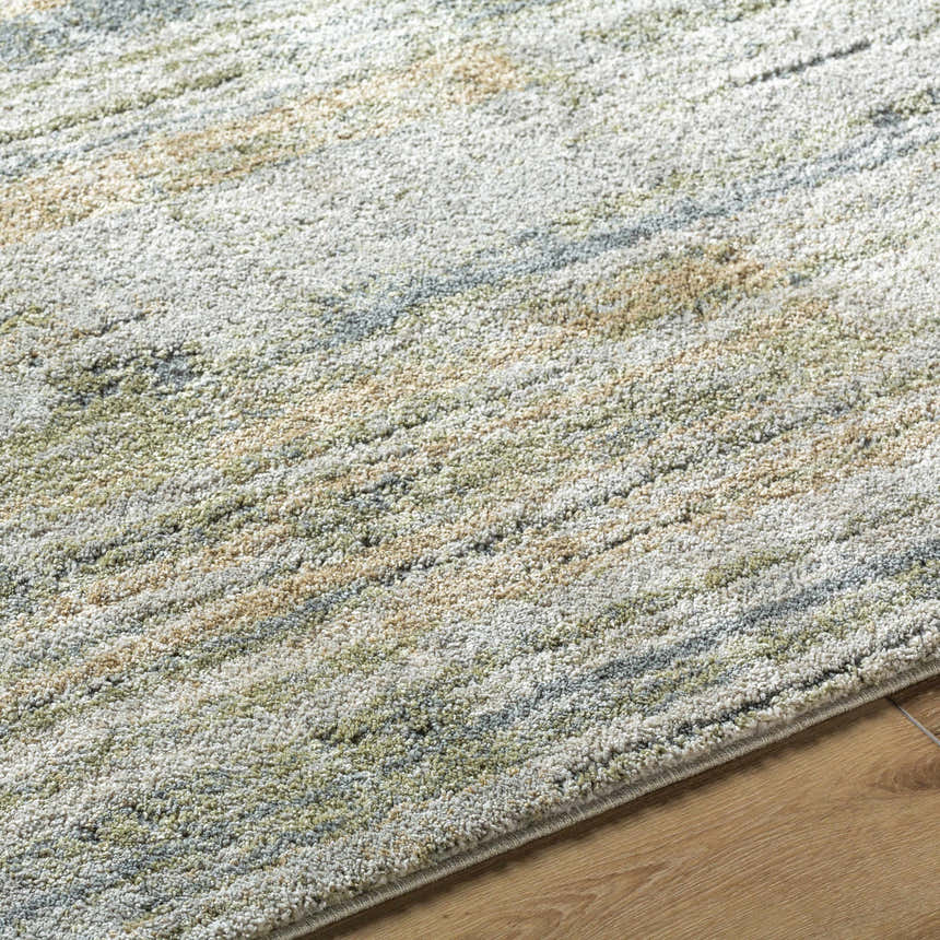 Close-up of the Yancy Thick Luxe Rug. Beige, gray, light gray, olive, and tan colors with a contemporary style. Texture