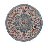 Close-up of round Tigril Blue 2303 area rug. Beige, ivory, and turquoise floral bohemian pattern. Design-Round