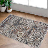 Entryway with Marden Textured Luxe Area Rug in brick red, camel, charcoal, cream, and gray on wood floor. Roomscene-Rectangle