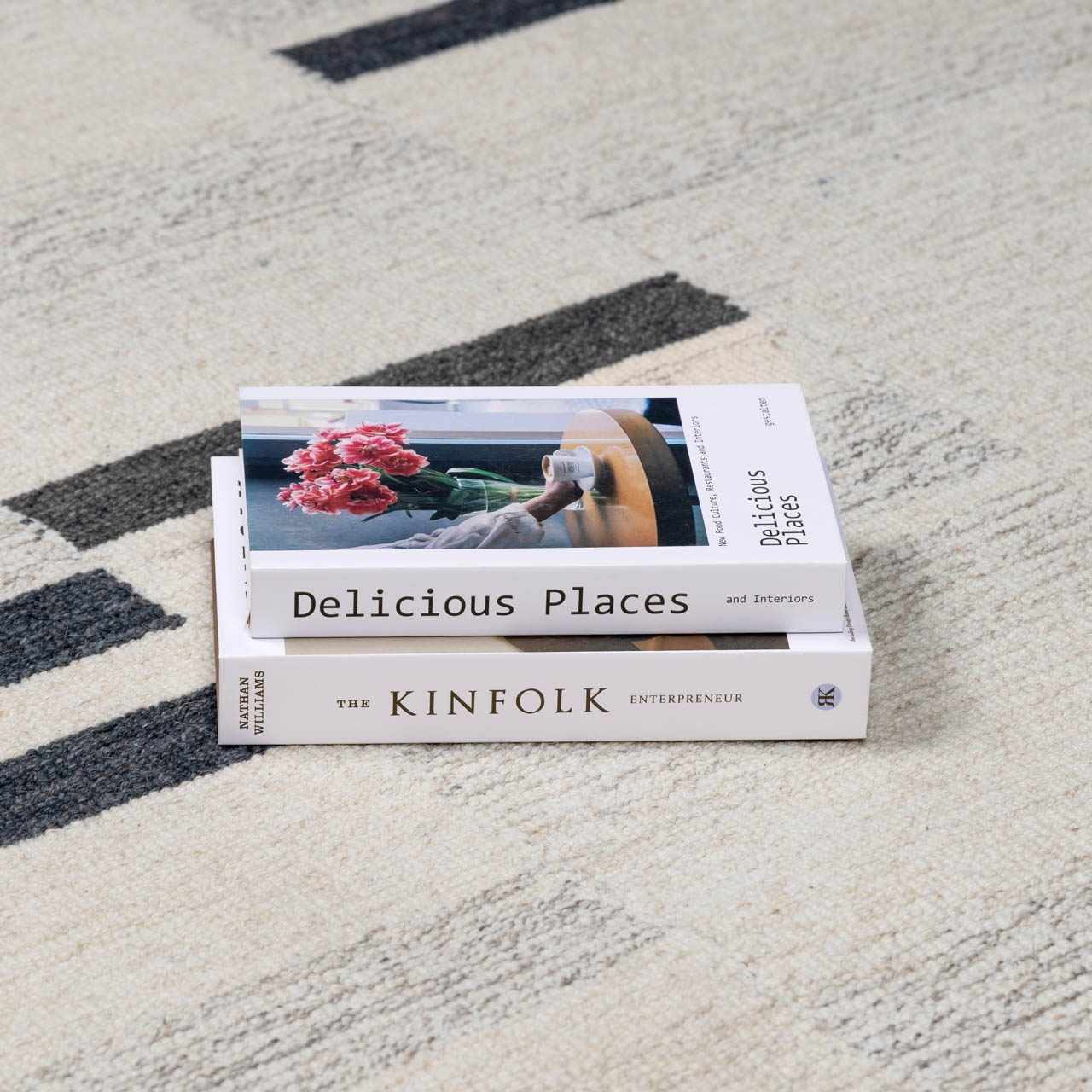 Close-up of the Aibonito Hand Tufted Wool Area Rug in beige and charcoal with a geometric pattern and textured wool. Styleshot