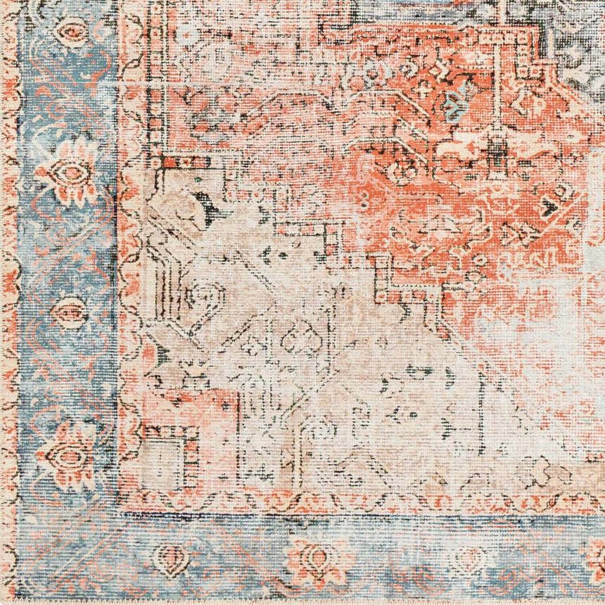 Close up of the Livabliss Amelie AML-2309 rug, showcasing its traditional design, beige, rust, and blue colors. Swatch
