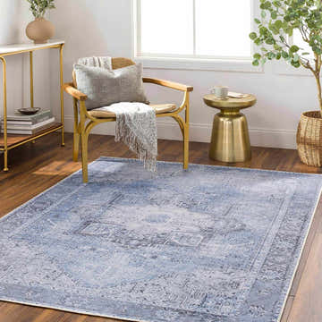 Living room scene with Ice Blue Flat Pile Washable Rug. Farmhouse style with gold accents and a light, airy feel. Roomscene-Rectangle