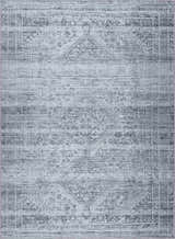Close-up of the Barny Gray Blue Washable Rug featuring a traditional, faded charcoal and blue pattern. Design-Rectangle-5373