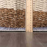 Close-up of the Barny Gray Blue Washable Rug showing texture and thickness with a ruler for scale. Pile