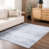 Living room scene with a Barny Gray Blue Washable Rug, cream sofa, wood cabinet, and dark wood floors. Modern farmhouse style. Roomscene-Rectangle