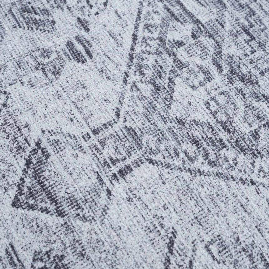 Close-up of the Barny Gray Blue Washable Rug, showing its charcoal and off-white traditional pattern and chenille texture. Texture