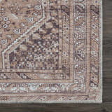 Close up of the Barny Brown flat pile washable rug showing its traditional cream and brown pattern. Swatch