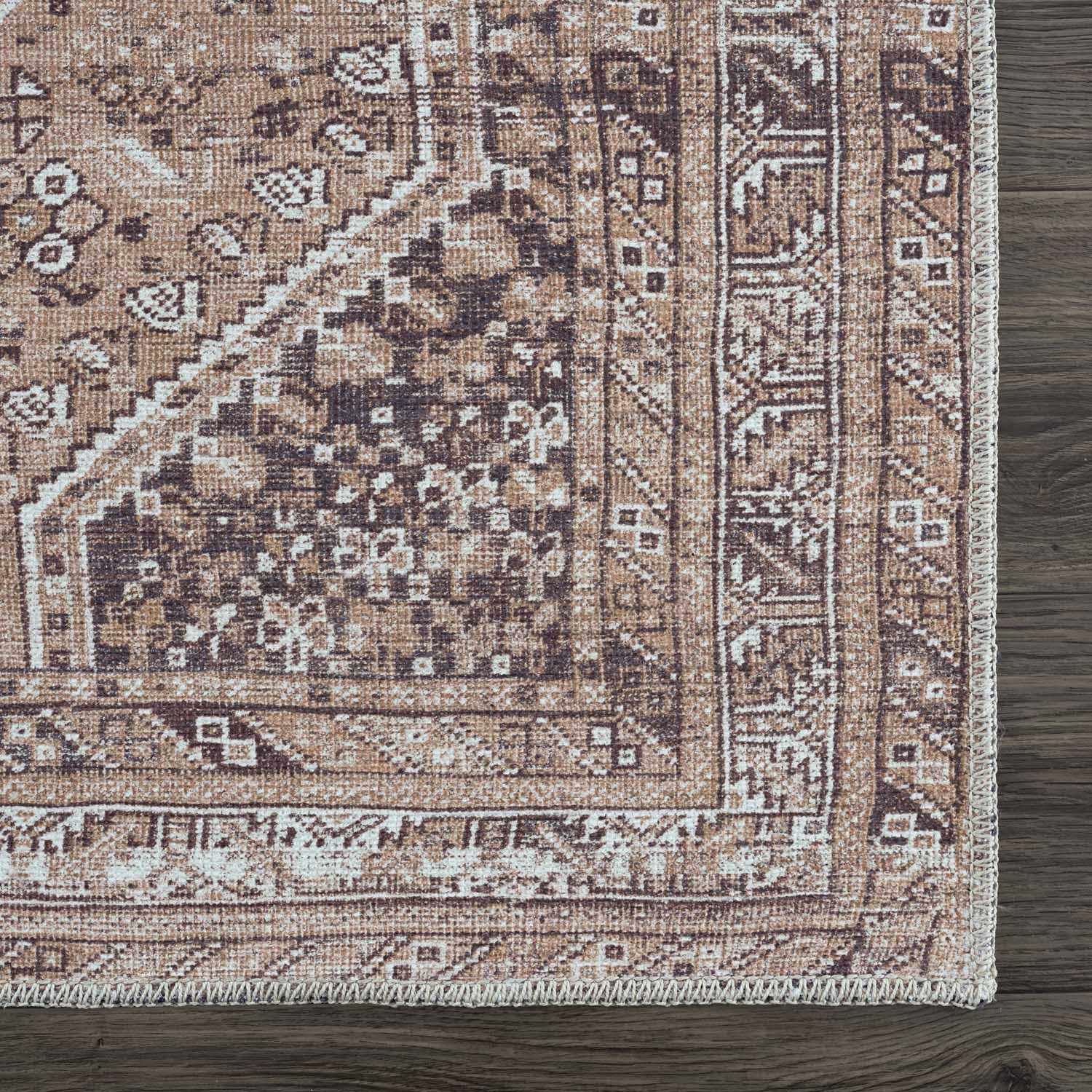 Close up of the Barny Brown flat pile washable rug showing its traditional cream and brown pattern. Swatch