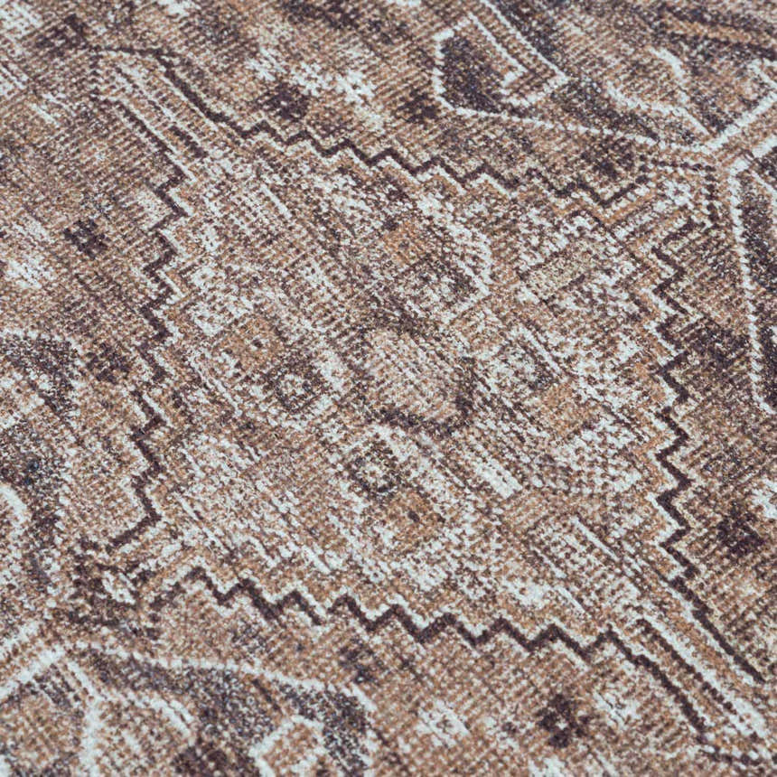 Close-up of the Barny Brown Flat Pile Washable Rug, showcasing its geometric pattern and cream, light brown, and medium gray colors. Texture
