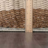 Close up of the Haile Boutique Washable Rug showing its thickness with a ruler and a basket. Pile