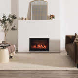 Living room scene with a cream Lucerne Plain Wool Rug, fireplace, brown sofa, and neutral decor. Roomscene-Rectangle