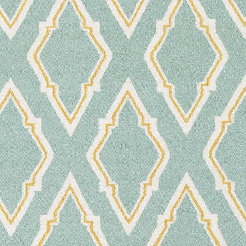 Close-up of Atlantic Area Carpet. Hand-woven wool rug in cream, mustard, and seafoam with a geometric diamond pattern. Swatch