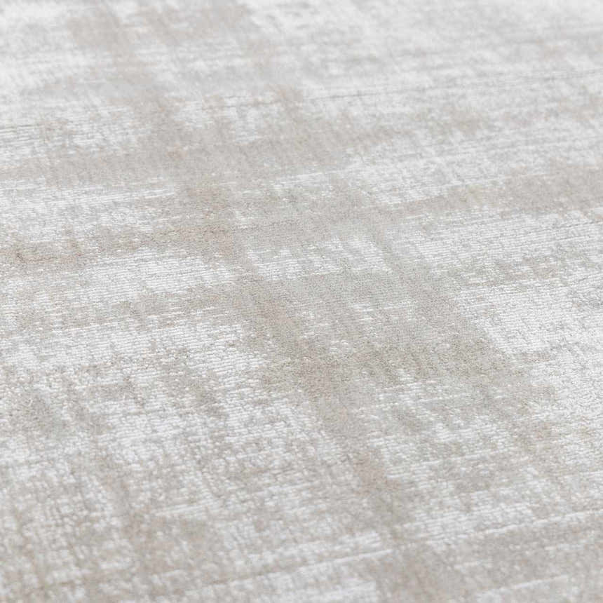 Close-up of the Auchter Soli Taupe rug. The premium sheer carpet has a subtle striped pattern and soft, textured viscose material. Texture