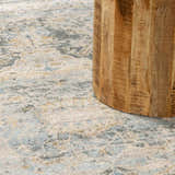 Close-up of the Vaeda Blue Thick Luxe Rug showing its beige, gray, and blue abstract pattern and soft texture. Styleshot