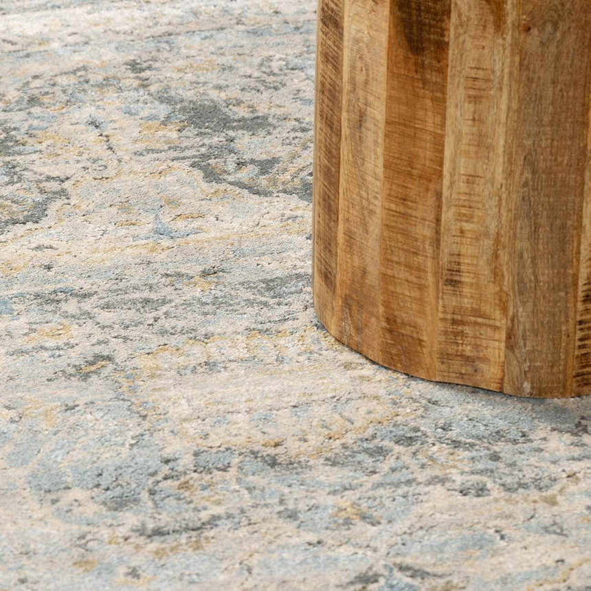 Close-up of the Vaeda Blue Thick Luxe Rug showing its beige, gray, and blue abstract pattern and soft texture. Styleshot