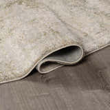 Close up of the beige and gray Zazie Thick Luxe Rug showing its plush texture and backing. Fold