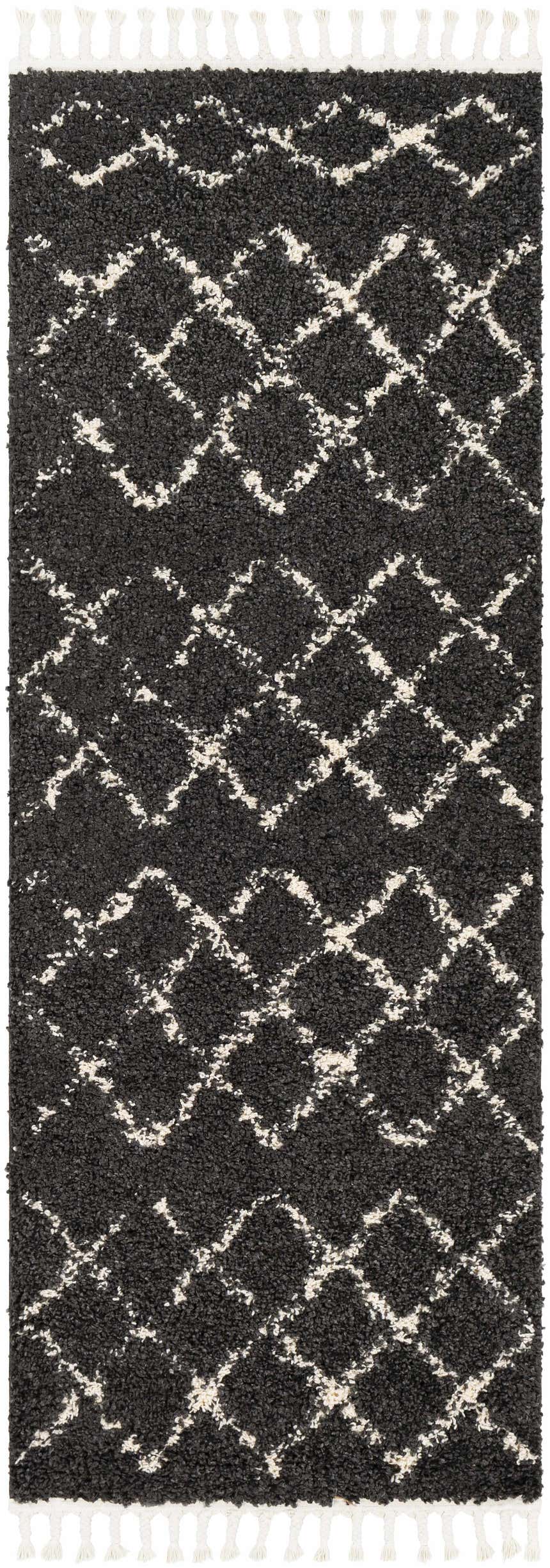 Close-up of the Wallagrass Black Moroccan Shag Rug, featuring a light beige diamond pattern and white tassels. Design-Runner-2773