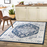 Farmhouse kitchen with Livabliss Chester CHE-2313 rug in beige, charcoal, and navy. Round table, wood chair, and neutral cabinets. Roomscene-Rectangle