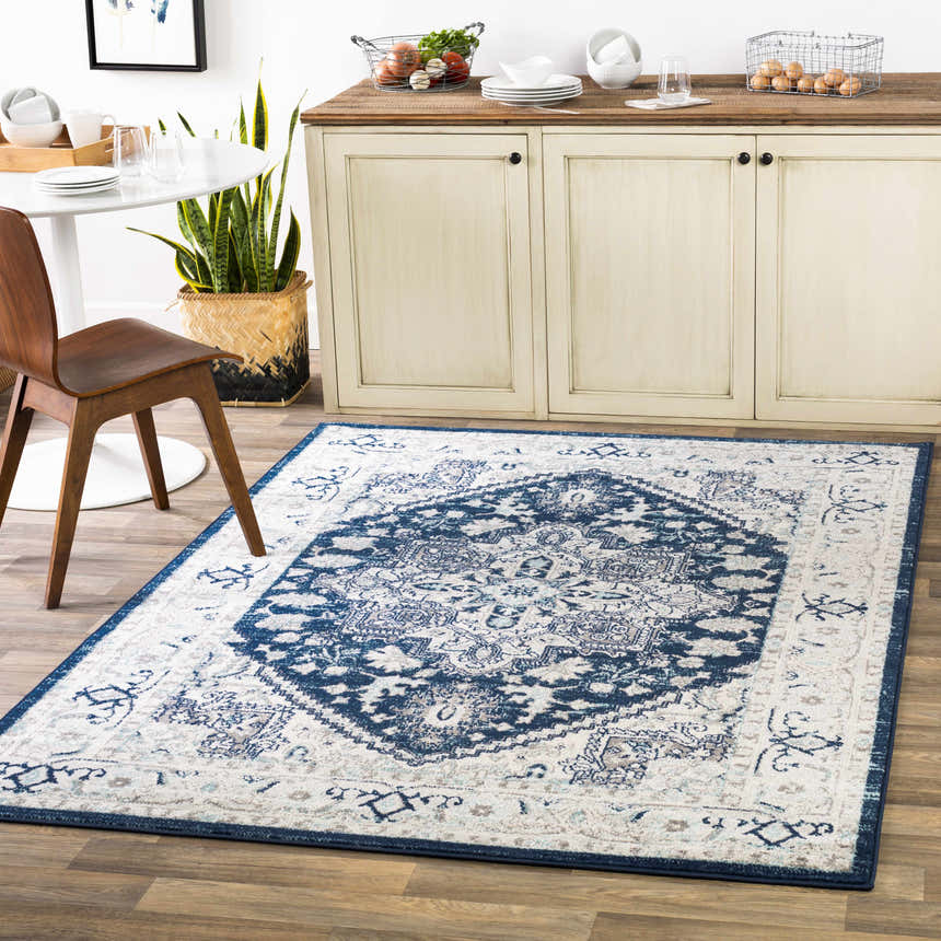Farmhouse kitchen with Livabliss Chester CHE-2313 rug in beige, charcoal, and navy. Round table, wood chair, and neutral cabinets. Roomscene-Rectangle