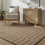 Living room scene with Idaho Broken-Striped Brown Area Rug, beige chair, and wood cabinet in a contemporary style. Roomscene-Rectangle