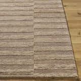 Close-up of the hand-tufted Idaho Broken-Striped Brown Area Rug. Beige and taupe wool rug with a contemporary broken stripe pattern. Front