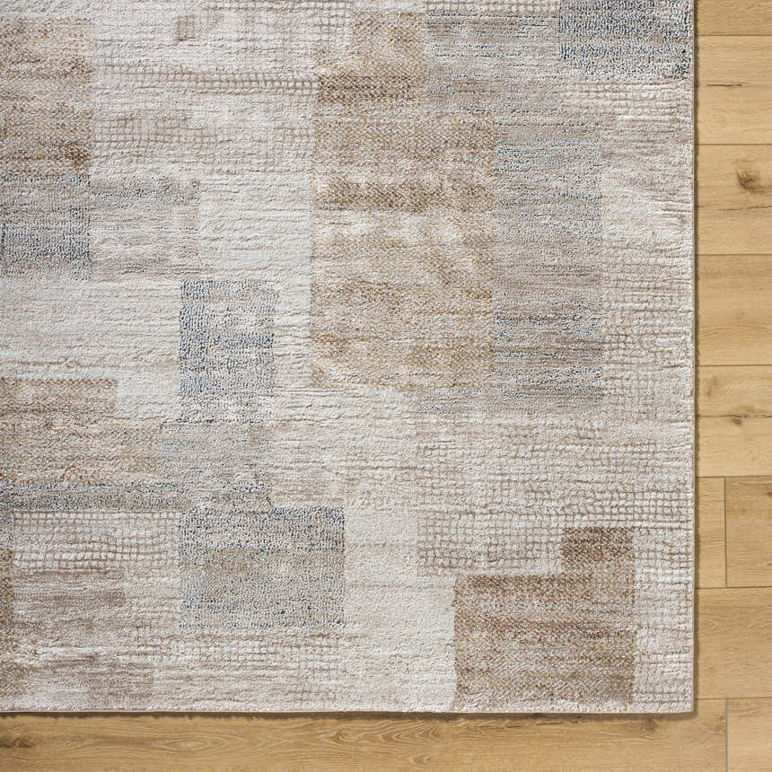 Close up of the Anaisa Beige Luxe Thick Area Rug, showing geometric pattern and soft texture on wood floor. Swatch