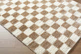 Close-up of Belita Cream Luxe Shag Area Rug with a tan and ivory checkerboard pattern and soft, plush texture. Corner