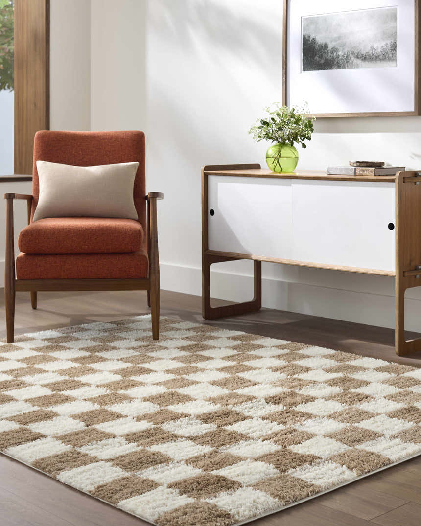 Living room scene with a Belita Cream Luxe Shag Area Rug, orange chair, and mid-century modern cabinet. Roomscene-Rectangle