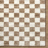 Close up of Belita Cream Luxe Shag Area Rug showing checkered cream and tan pattern and soft shag texture. Corner