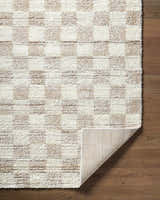 Close-up of Belita Beige Luxe Shag Area Rug showing cream, ivory, and tan tones with a soft, textured shag pile. Fold