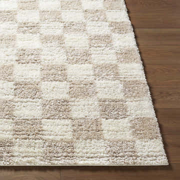 Close-up of the Belita Beige Luxe Shag Area Rug featuring a cream and tan checkerboard pattern and plush, soft texture. Front
