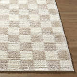 Close-up of Belita Beige Luxe Shag Area Rug showing cream, ivory, and tan checkerboard pattern and soft, plush texture. Front
