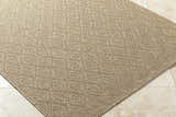 Close-up of the Bandit Brown Area Rug showing its camel color, woven texture, and geometric diamond pattern. Corner