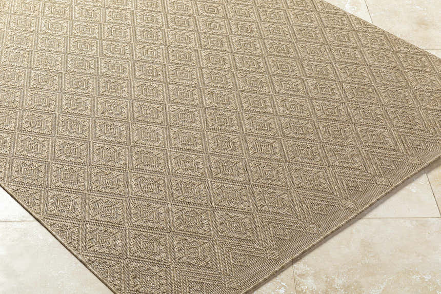 Close-up of the Bandit Brown Area Rug showing its camel color, woven texture, and geometric diamond pattern. Corner