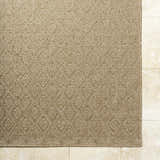 Close-up of the Bandit Brown Area Rug showing its woven diamond pattern and tan, camel, and prairie dust colors. Corner