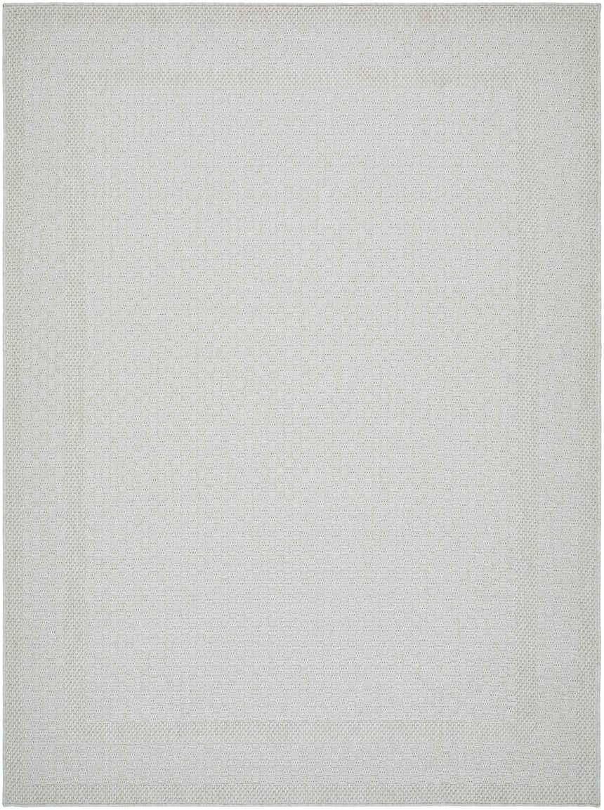 Close-up of the Brinda Area Rug. Light silver and sterling gray tones with a subtle, textured geometric pattern. Design-Rectangle-537