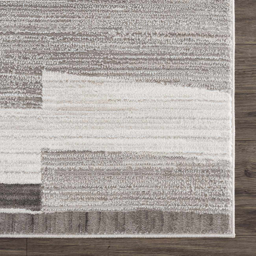 Close up of Bojana Broken-Striped Area Rug. Geometric design in black, cream, off white, and vizon. Machine woven texture. Swatch