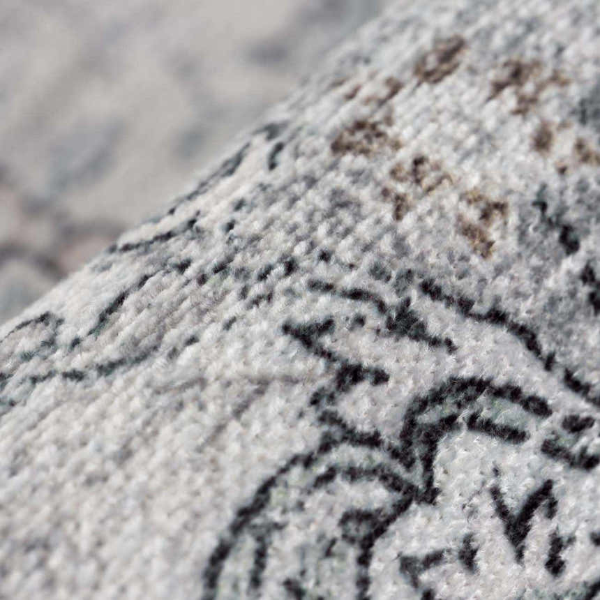 Close-up of the Light Blue Holi-4603 Washable Area Rug showing its texture and traditional vintage pattern. Fold