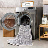 Light Blue Holi-4603 washable rug being washed in a laundry room with a washing machine and laundry supplies. Washing-Machine