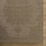 Close up of the beige Bahula Area Rug showing the traditional woven pattern and texture. Corner