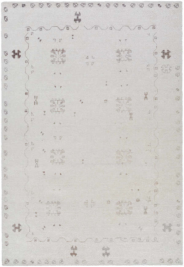 Close-up of the hand-tufted Bhavna Area Rug. Ivory rug with sandstone and taupe traditional pattern. 100% polyester. Design-Rectangle-576