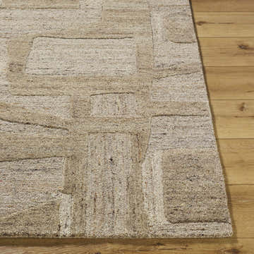 Close up of the hand tufted Brasen Tan Area Rug, a beige and tan wool rug with a geometric pattern. Front