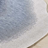 Close-up of the machine woven Burian Blue Area Rug showing the blue and cream farmhouse style pattern and texture. Texture