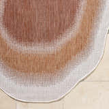 Close-up of Burian Orange Area Rug showing woven texture, burnt orange, cream, and rust colors. Corner