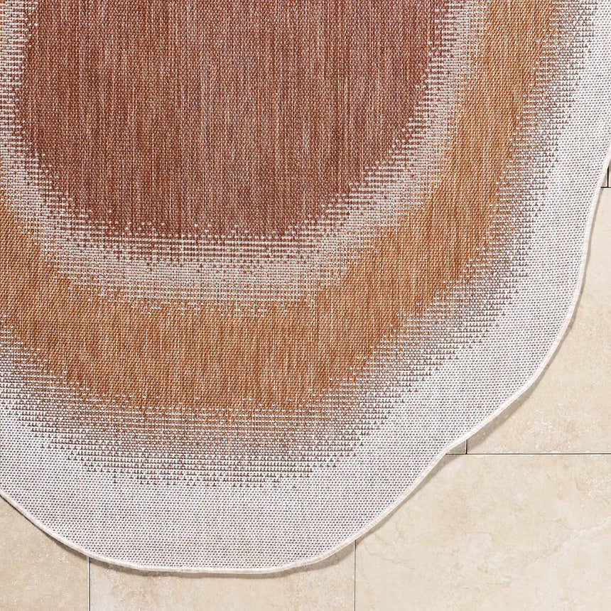 Close-up of Burian Orange Area Rug showing woven texture, burnt orange, cream, and rust colors. Corner