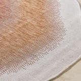 Close-up of Burian Orange Area Rug showing burnt orange and cream woven texture and pattern. Texture