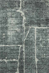 Close-up of the Janek II Modern Abstract Area Rug. Hand-tufted polyester rug in shades of gray with a white abstract pattern. Design-Rectangle